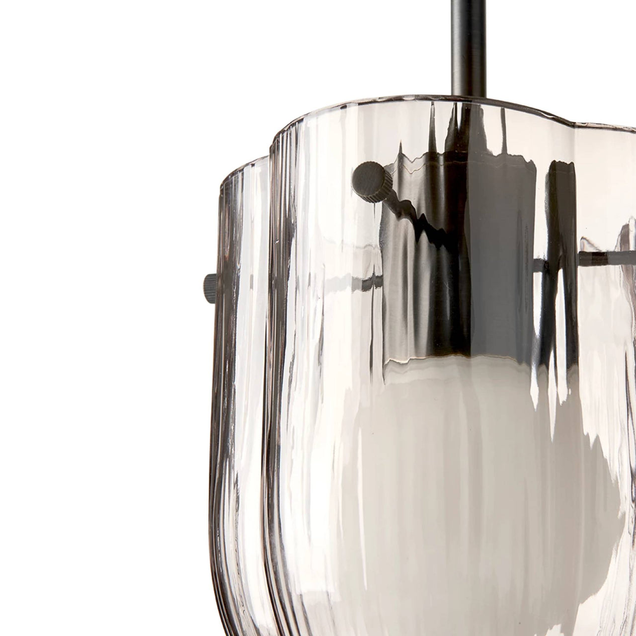 Close-up of a pendant light with a ribbed smoked glass shade, scalloped rim and dark metal rod
