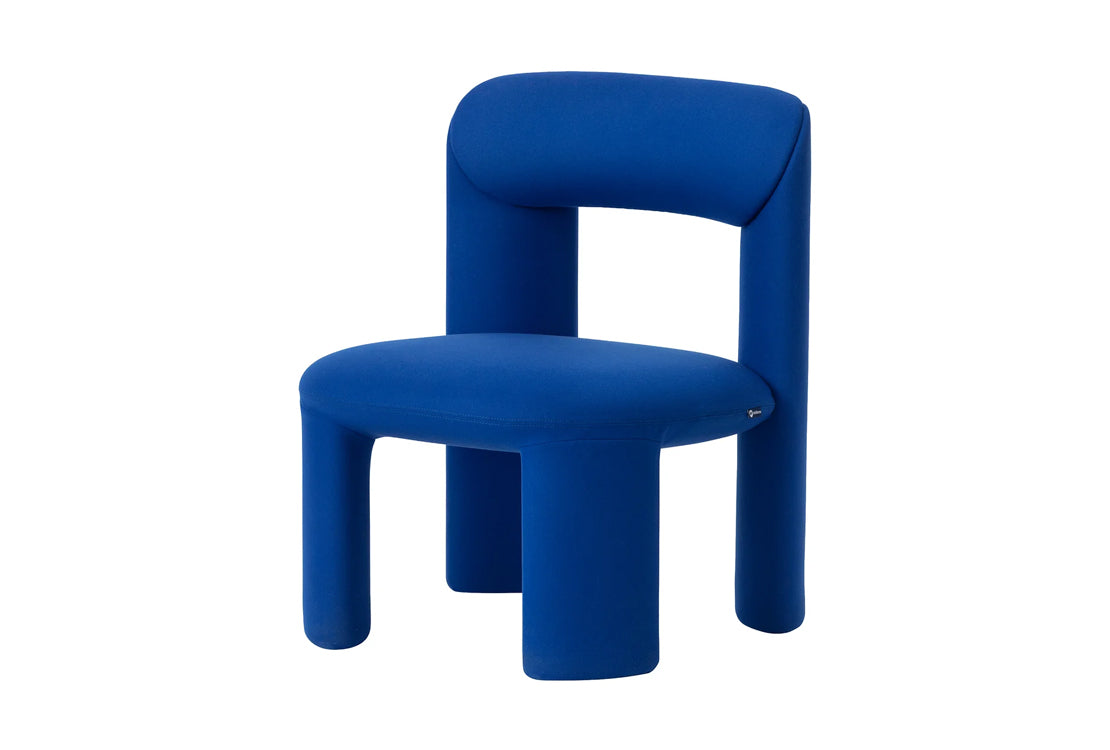 A modern blue upholstered chair with a thick, rounded backrest and cylindrical legs, shown against a plain white background.