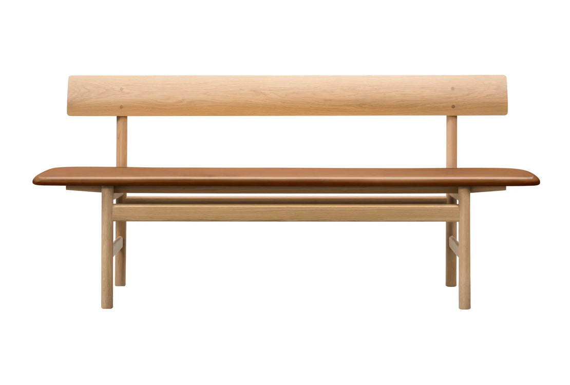 Wooden bench with a backrest on a white background
