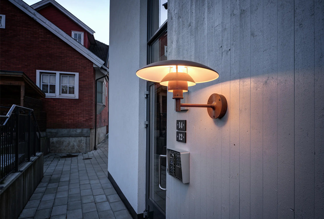 Outdoor wall light next to door in alleyway