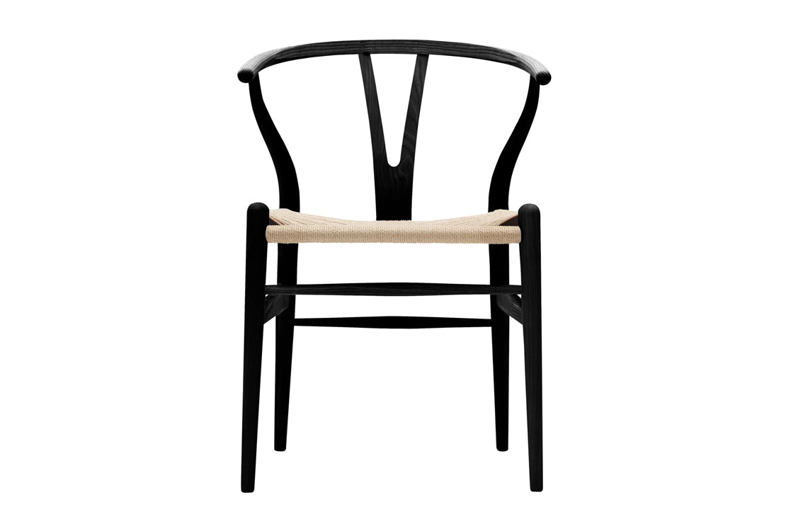 A modern black wooden dining chair with a curved backrest and a light natural woven seat, shown against a plain white background.