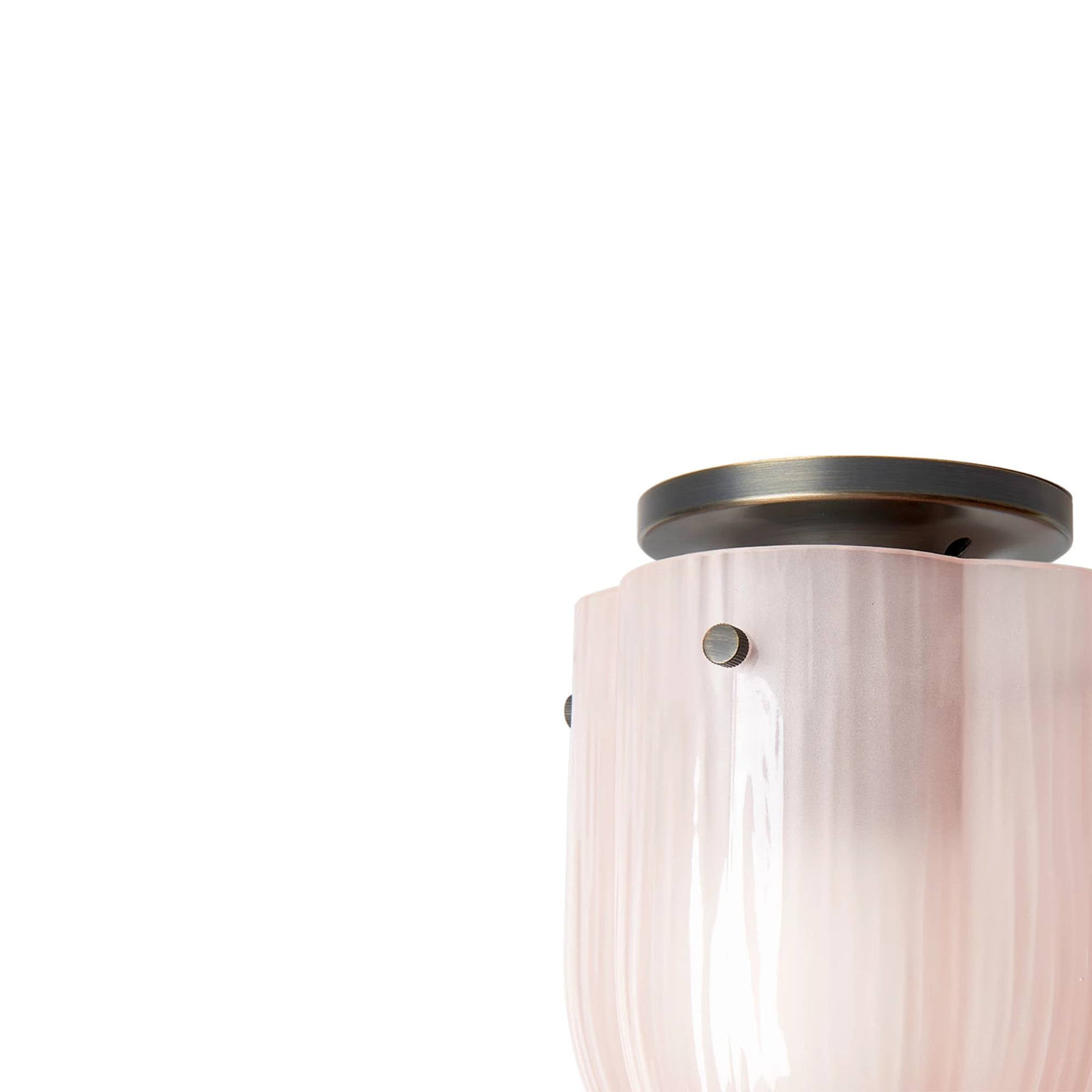 Close-up of a flush ceiling light with pale pink ribbed glass and a dark bronze round canopy